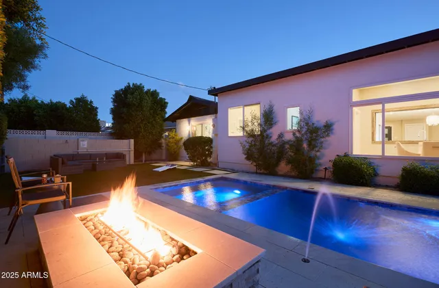 a view of swimming pool with outdoor seating