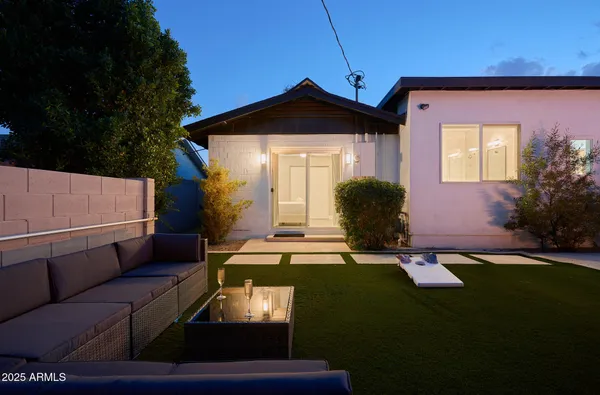 a front view of a house with garden