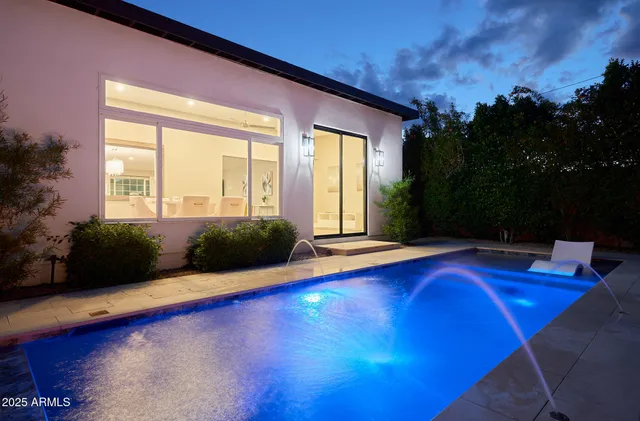 a view of swimming pool with seating space
