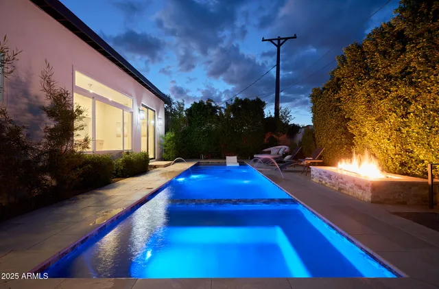 a view of swimming pool with seating area