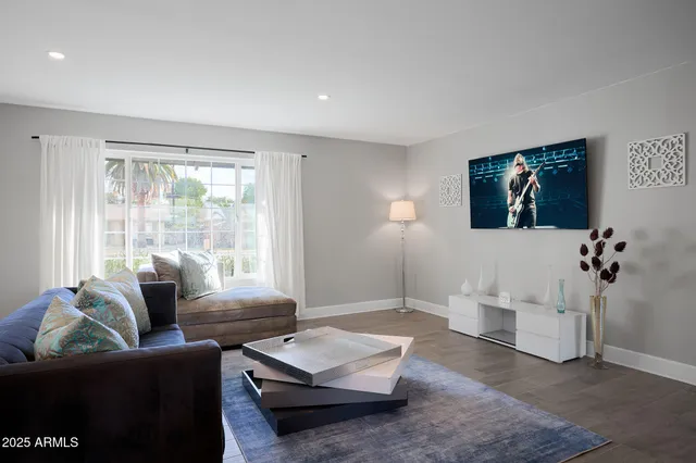 a living room with furniture and a window