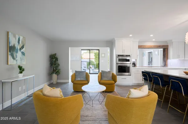 a view of a dining room with furniture and wooden floor