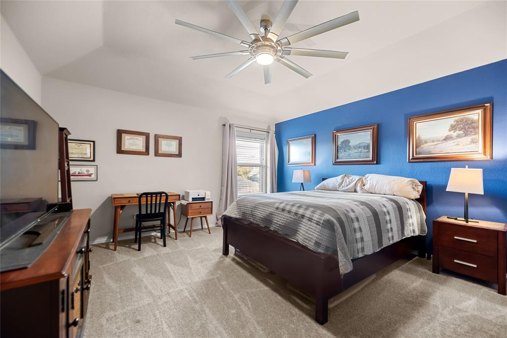 3616 Spring Run Lane Melissa, TX 75454 - Photo 12 of 23 a bedroom with a bed and a chandelier