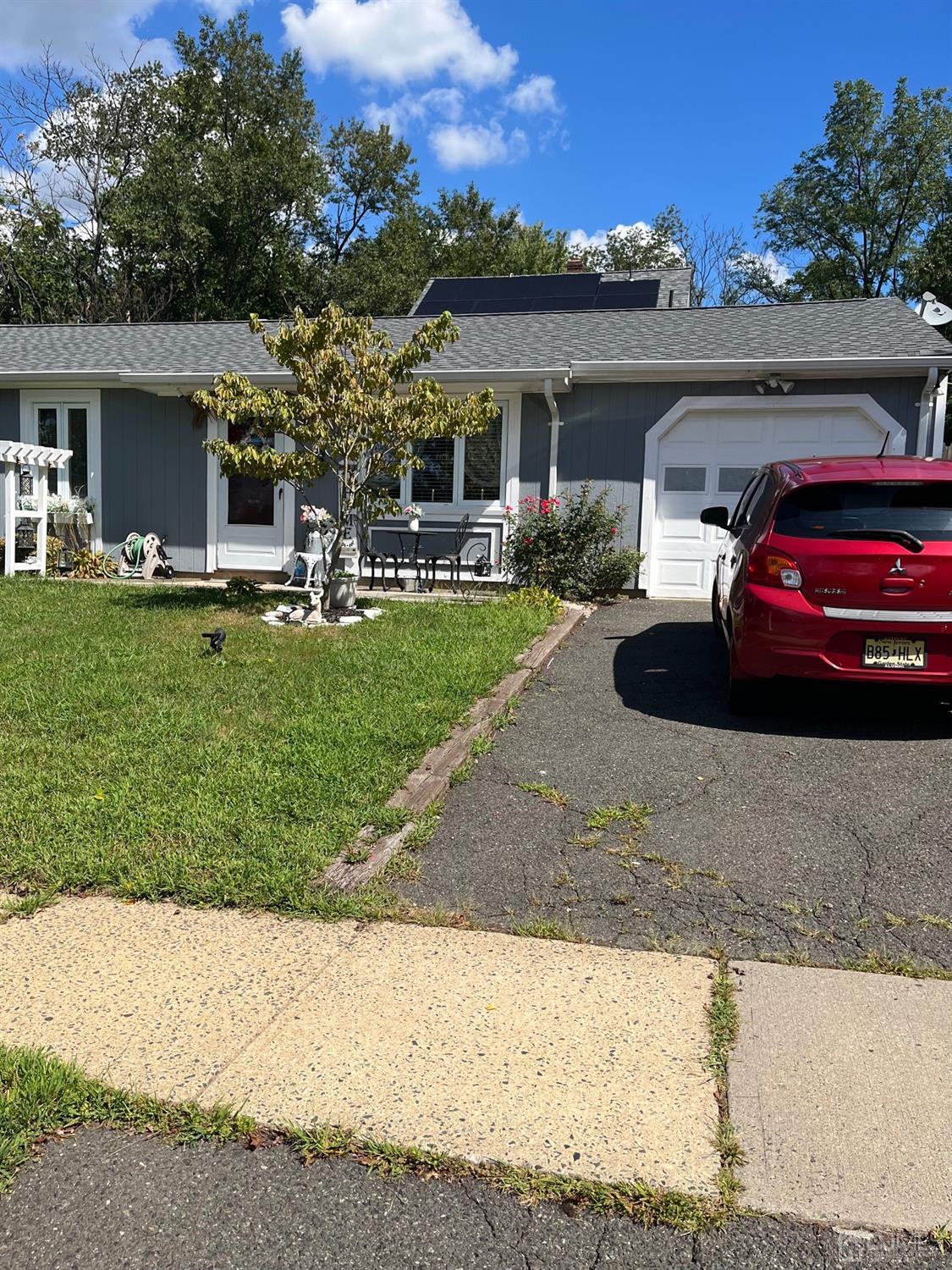 1 Brook Hollow Road Piscataway, NJ 08854 - Photo 11 of 18 a view of a car parked in front of a house