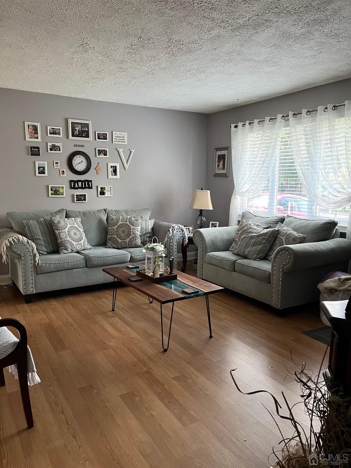 1 Brook Hollow Road Piscataway, NJ 08854 - Photo 13 of 18 a living room with furniture and a large window