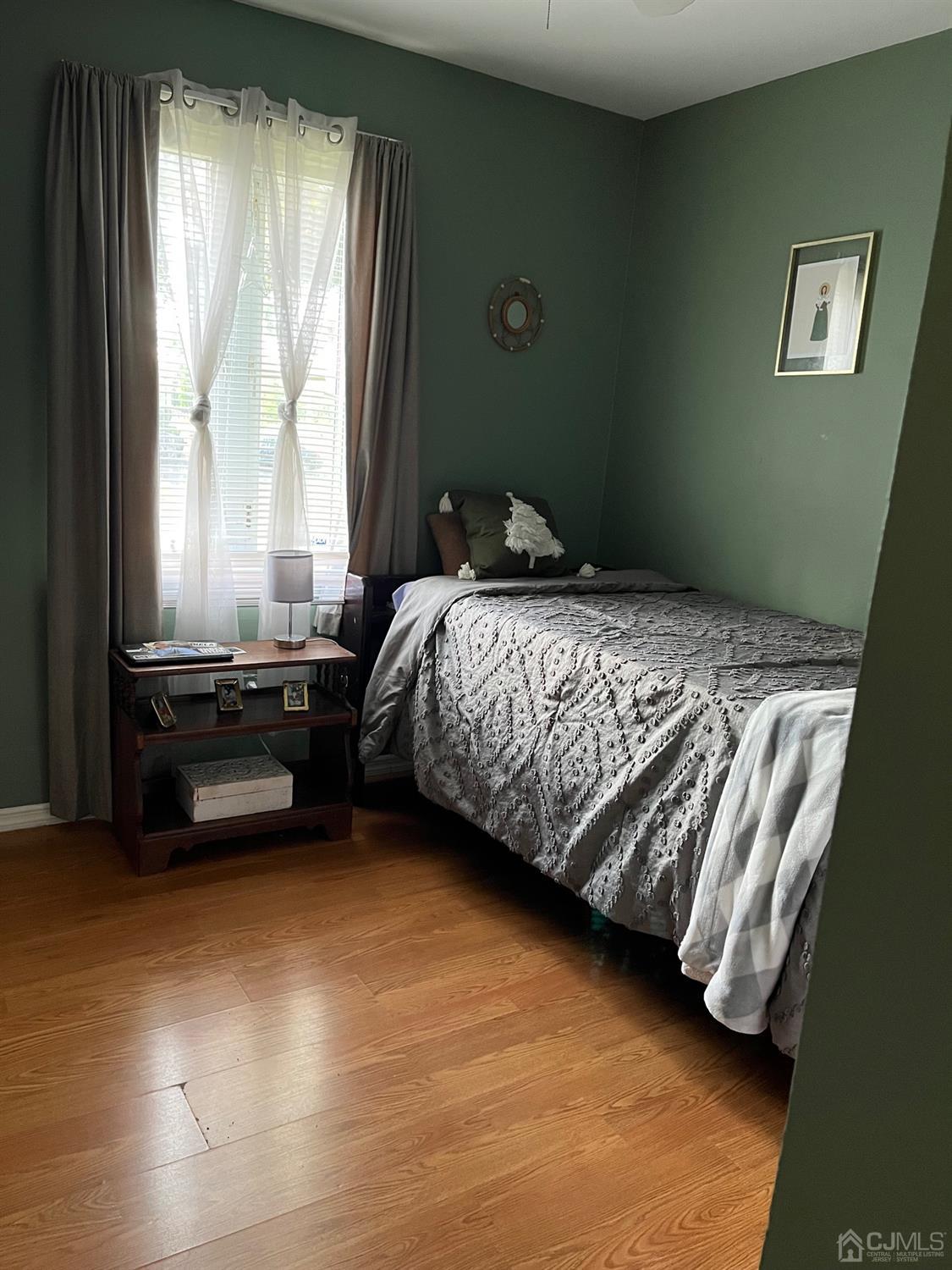 1 Brook Hollow Road Piscataway, NJ 08854 - Photo 15 of 18 a bedroom with a bed and a window