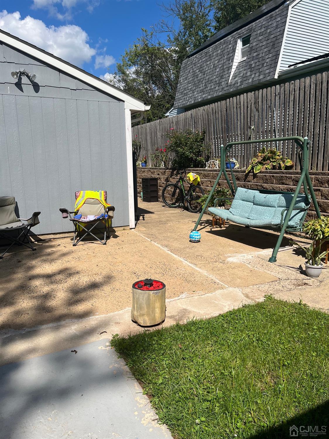 1 Brook Hollow Road Piscataway, NJ 08854 - Photo 3 of 18 a view of backyard with a table and chairs