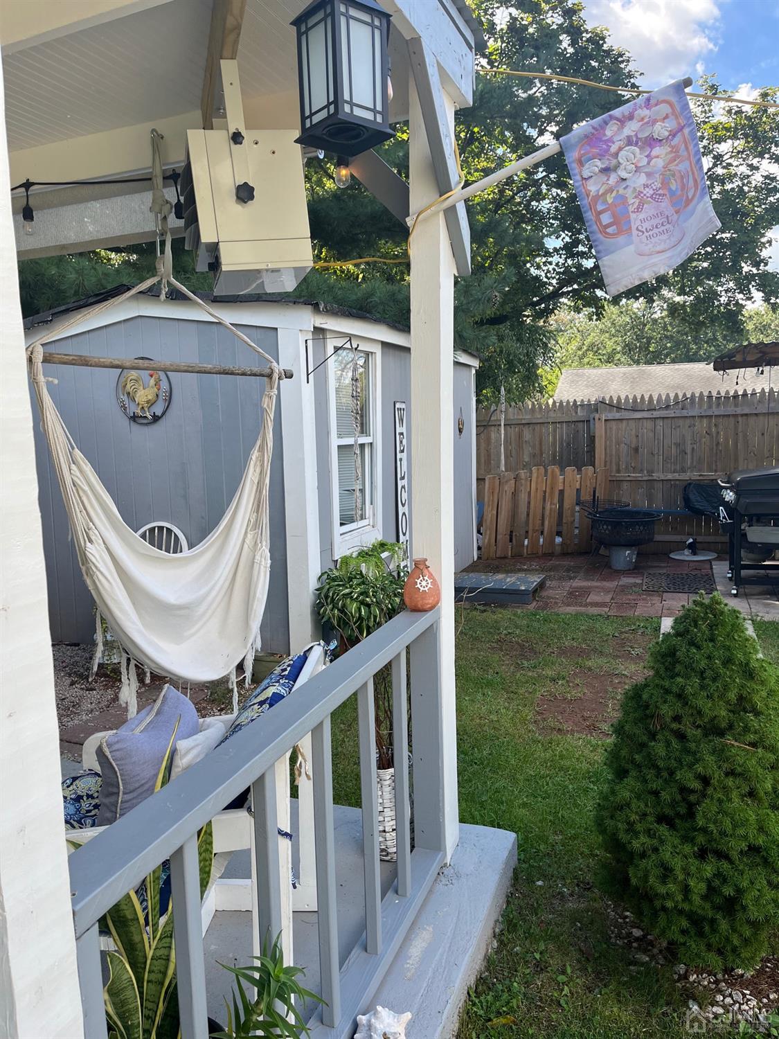 1 Brook Hollow Road Piscataway, NJ 08854 - Photo 4 of 18 a view of a chair and table in backyard