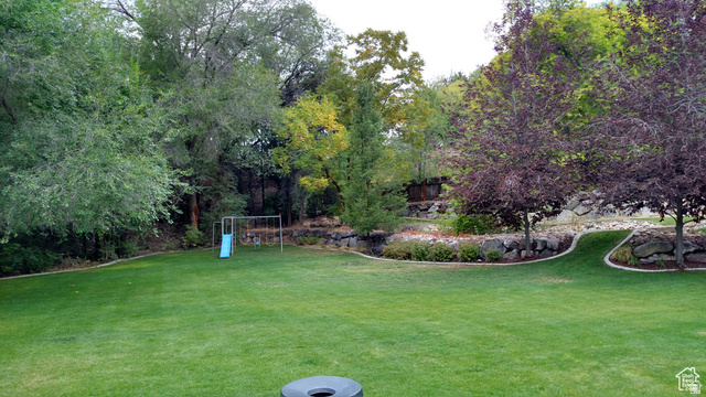 1360 Carterville Road Orem, UT 84097 - Photo 27 of 40 View of grassy yard with a playground