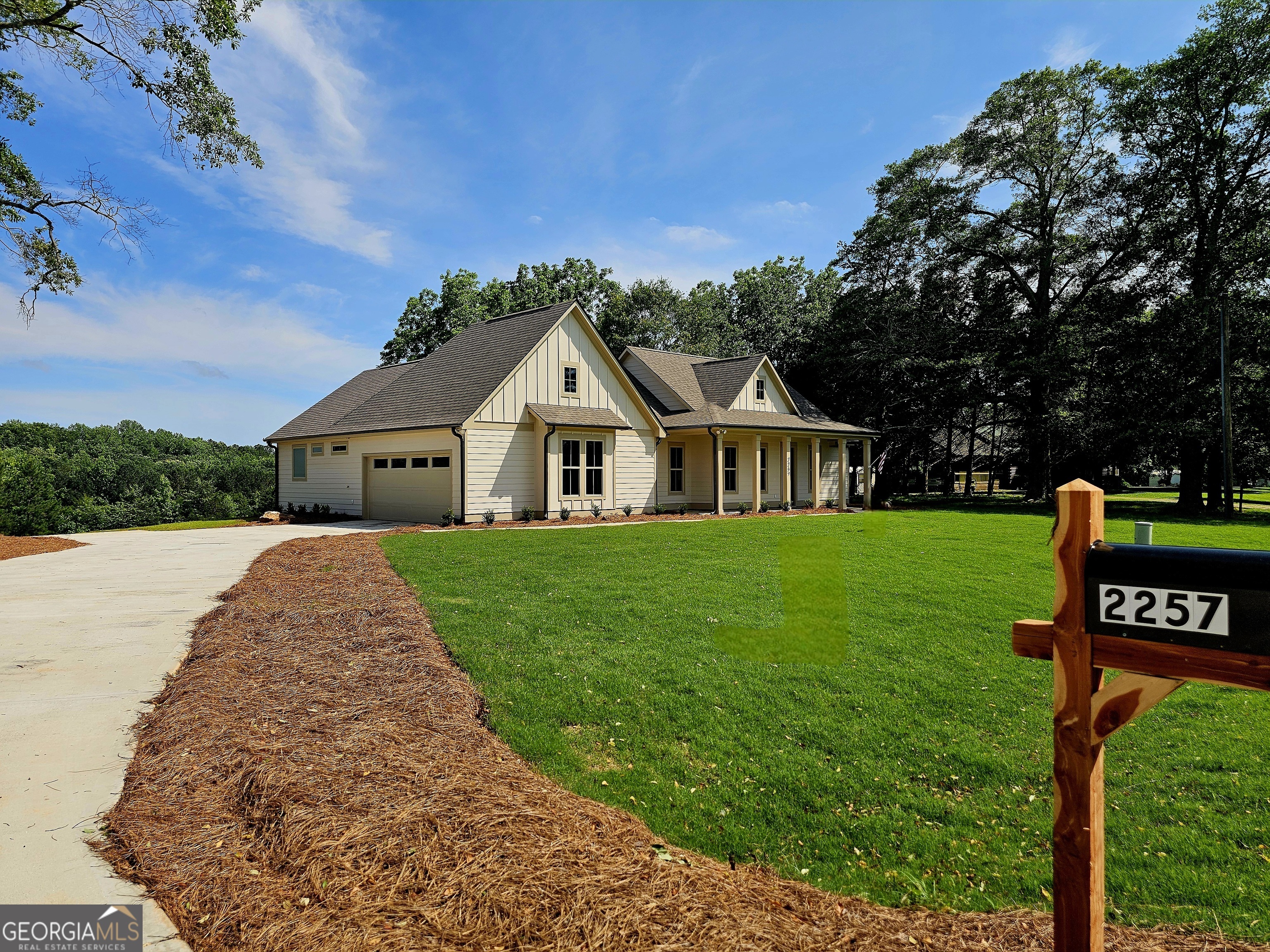 2257 Welcome Road Roopville, GA 30170 - Photo 1 of 1 a front view of a house with garden