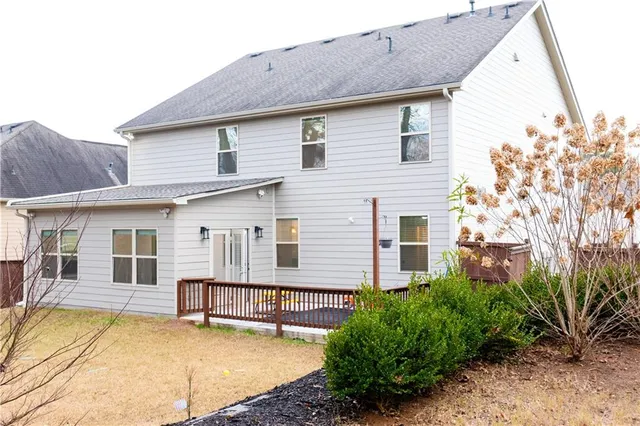 a view of a backyard of the house
