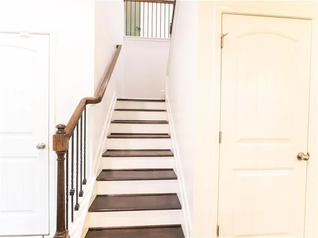 a view of a livingroom with a ceiling fan and window