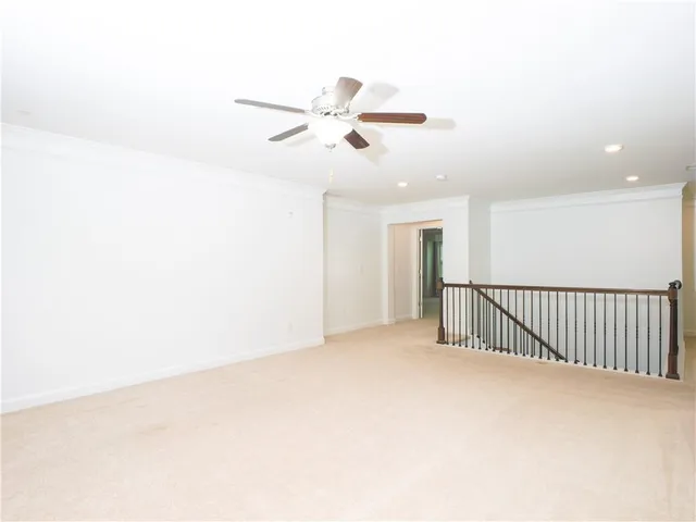 a view of an empty room and a window