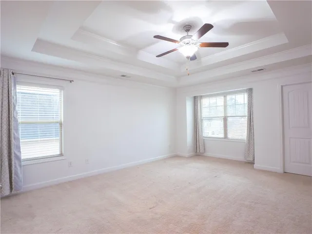 a view of an empty room and a window