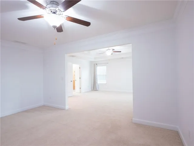 a bathroom with a toilet a sink and a large mirror