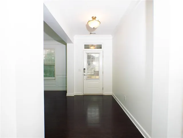 a view of kitchen with cabinets and wooden floor