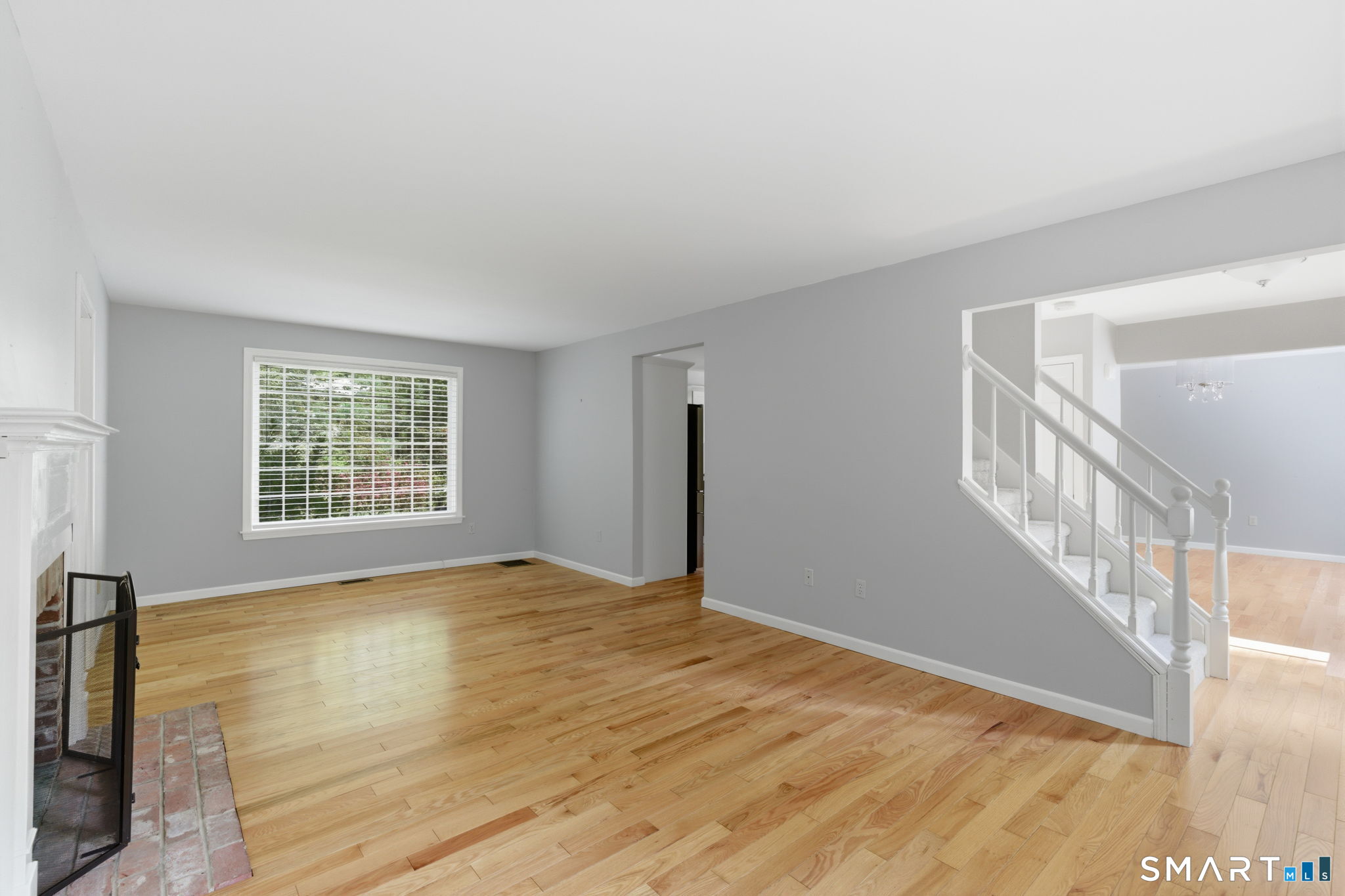 21 Greenwood Road North Granby, CT 06060 - Photo 6 of 40 a view of an empty room with wooden floor and a window