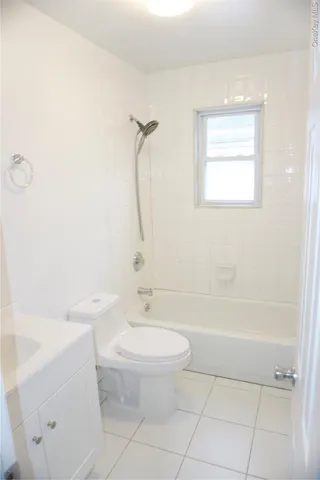 a bathroom with a toilet a sink and a shower