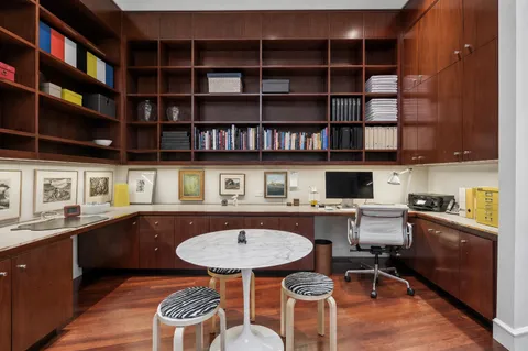 a kitchen with a breakfast area and cabinets