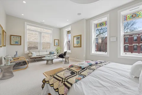a bedroom with furniture and a window