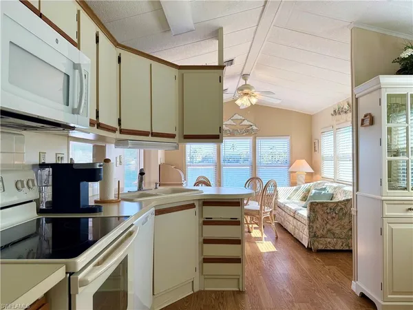 a kitchen with counter top space and stainless steel appliances