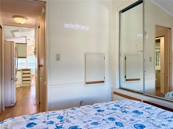 a bedroom with a bed and a dresser