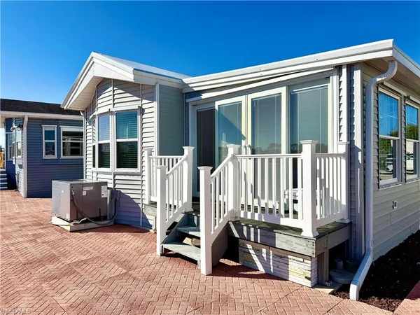 a view of a chair and table in the house