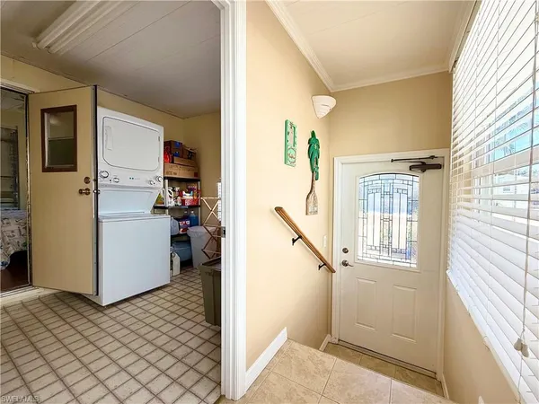 a view of hallway with stairs and furniture