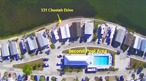 a view of a swimming pool with a patio