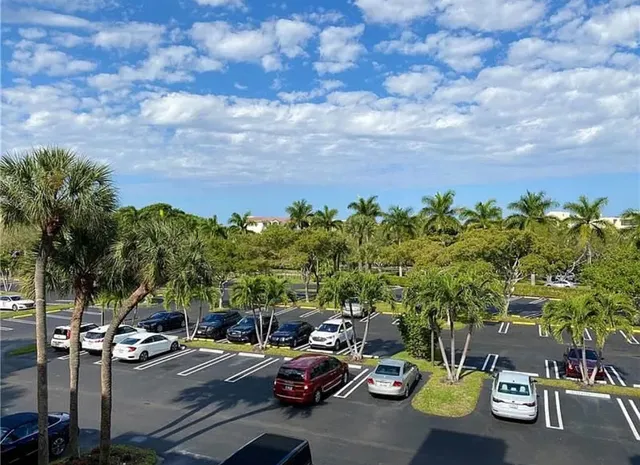 a view of a city street with cars