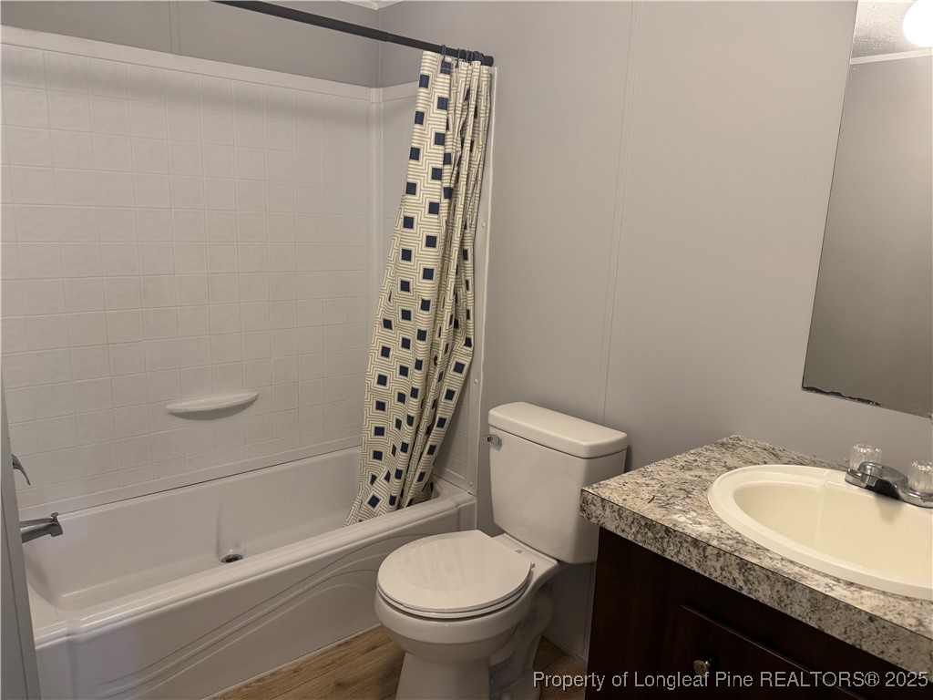 2273 Bee Gee Road Lumberton, NC 28358 - Photo 26 of 35 a bathroom with a granite countertop toilet and a sink