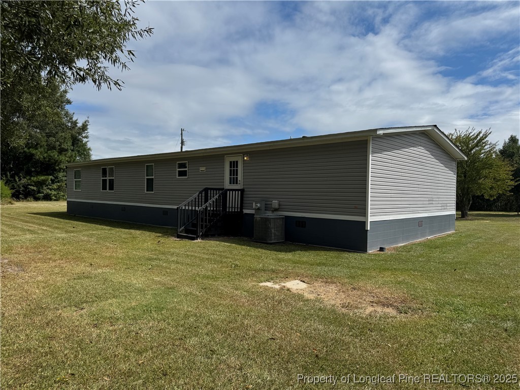 2273 Bee Gee Road Lumberton, NC 28358 - Photo 5 of 35 a view of a house with a backyard