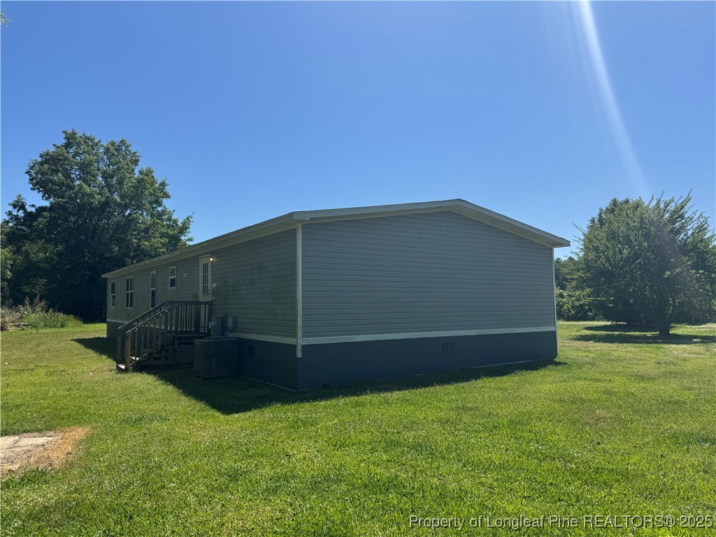 2273 Bee Gee Road Lumberton, NC 28358 - Photo 10 of 35 a view of backyard with wooden fence
