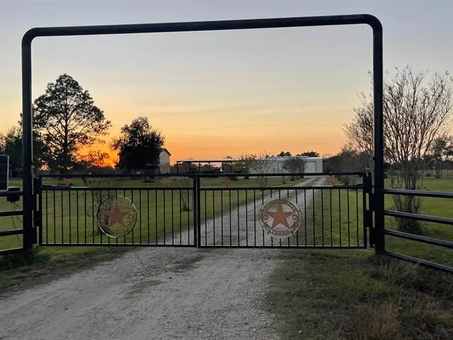 a view of a fence in the back yard