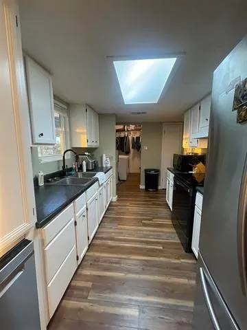 a view of a hallway with the table and couch