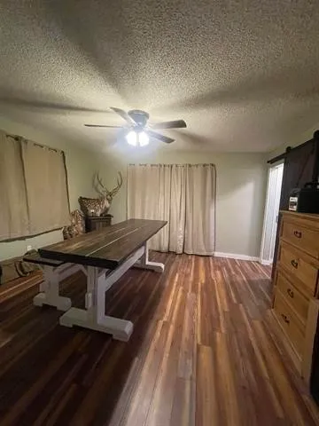 a room with furniture and wooden floor