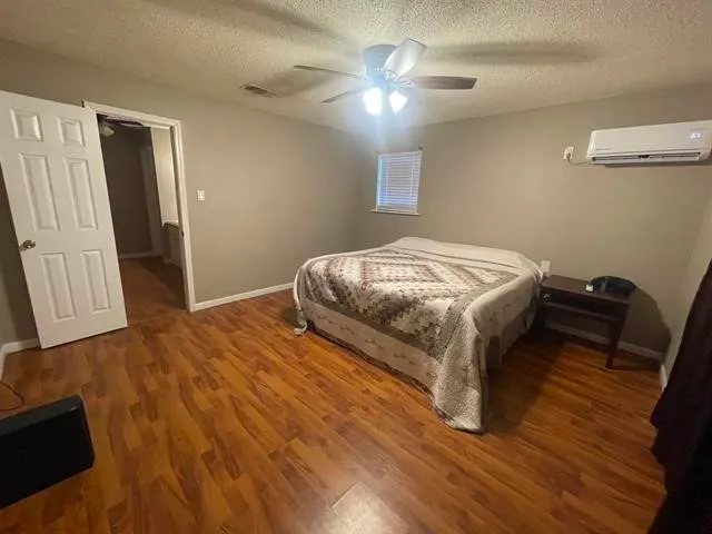 a view of a hallway to a livingroom and a fireplace