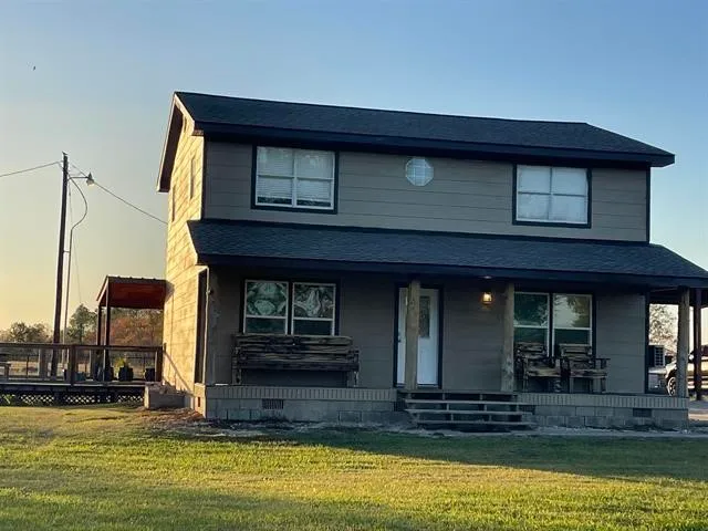 a view of a house with swimming pool