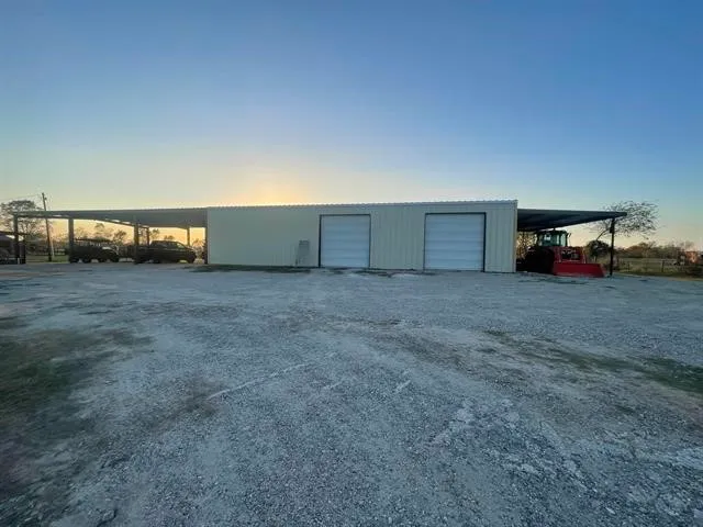 a view of a livingroom with furniture and a window