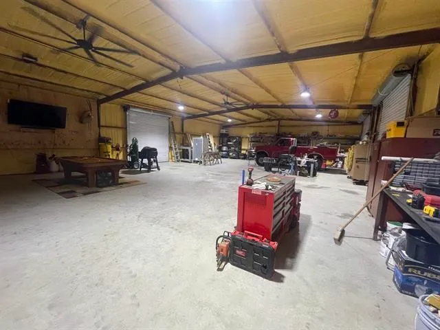 a view of parking garage with cars