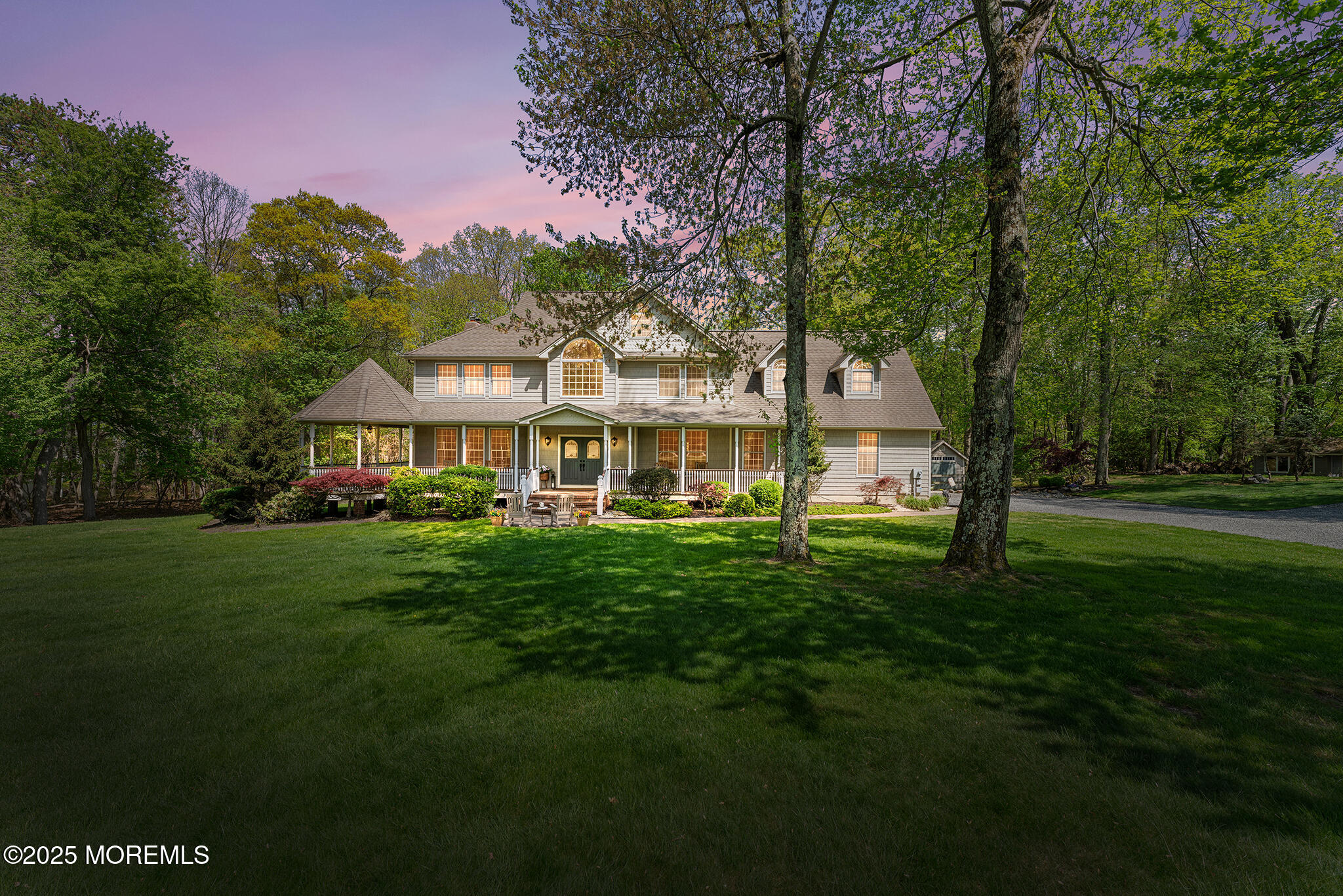 109 Merrick Road Farmingdale, NJ 07727 - Photo 1 of 62 a front view of a house with a garden