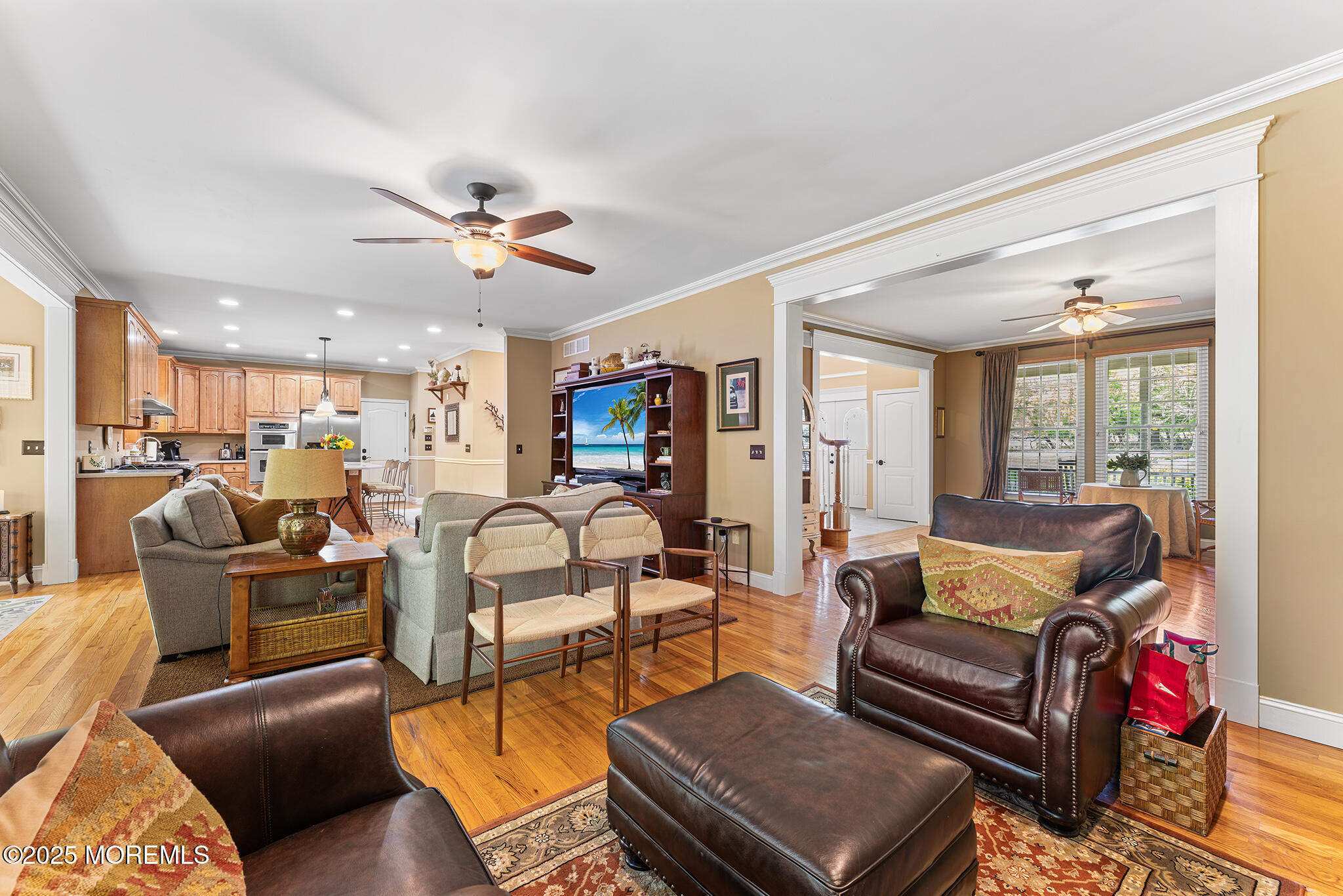 109 Merrick Road Farmingdale, NJ 07727 - Photo 11 of 62 a living room with furniture kitchen view and a chandelier