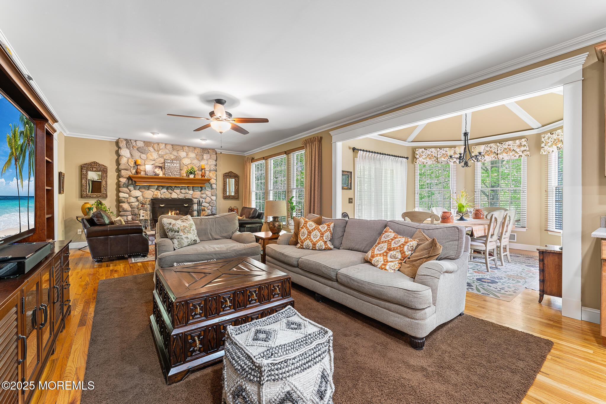 109 Merrick Road Farmingdale, NJ 07727 - Photo 12 of 62 a living room with furniture fireplace and a large window