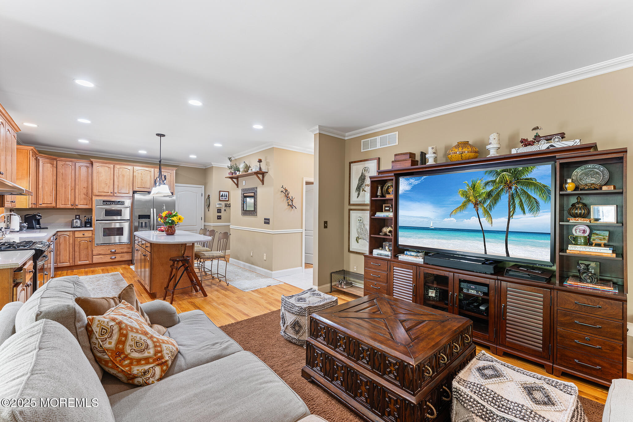 109 Merrick Road Farmingdale, NJ 07727 - Photo 13 of 62 a living room with furniture and a flat screen tv