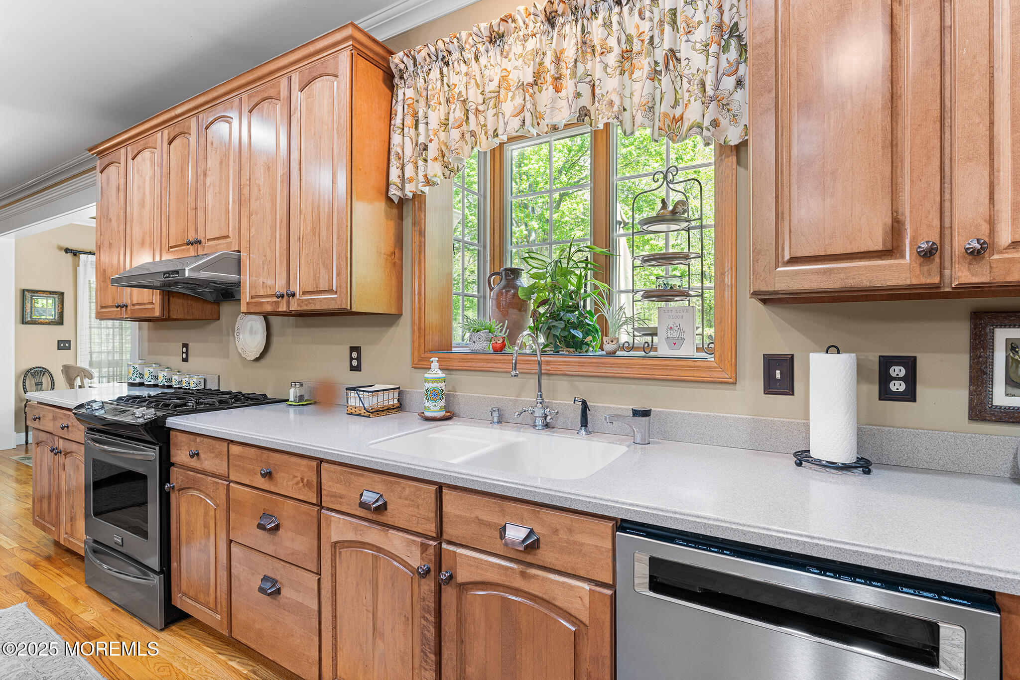 109 Merrick Road Farmingdale, NJ 07727 - Photo 18 of 62 a kitchen with stainless steel appliances granite countertop a sink a stove and a microwave