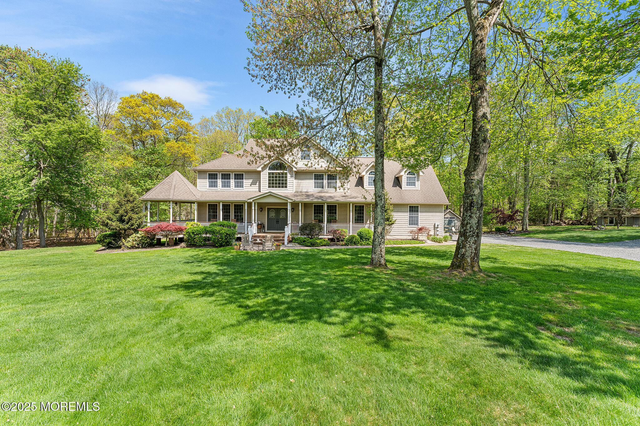 109 Merrick Road Farmingdale, NJ 07727 - Photo 2 of 62 a front view of a house with a garden