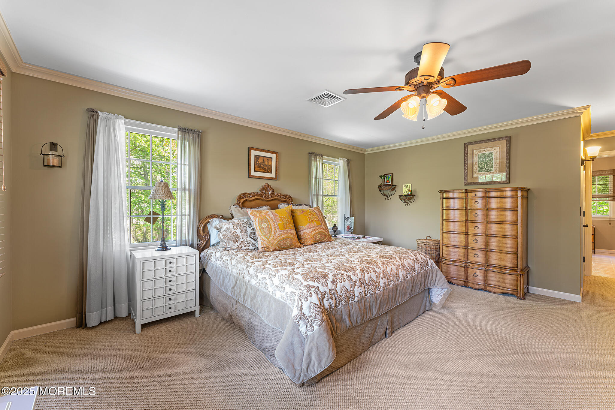 109 Merrick Road Farmingdale, NJ 07727 - Photo 26 of 62 a bed room with a bed and a chandelier