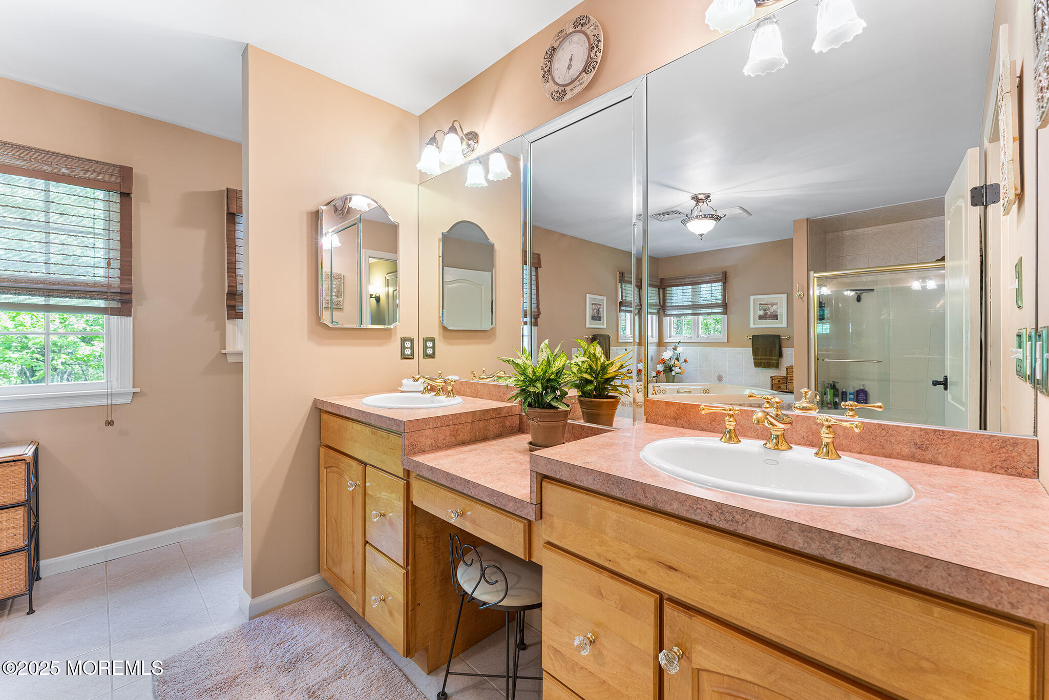 109 Merrick Road Farmingdale, NJ 07727 - Photo 27 of 62 a bathroom with a granite countertop sink a large mirror and a shower