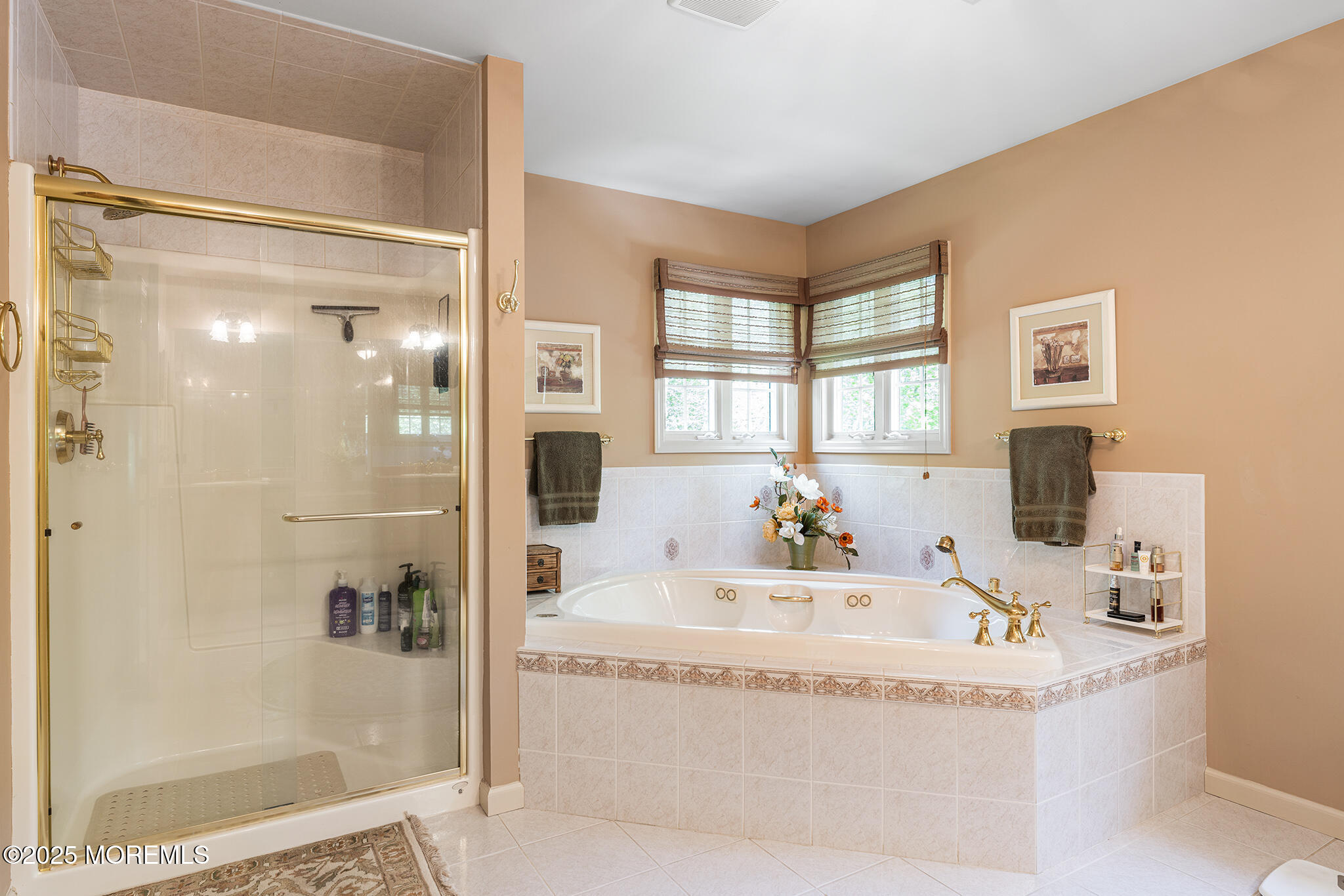 109 Merrick Road Farmingdale, NJ 07727 - Photo 28 of 62 a bath tub sitting next to a bathroom sink