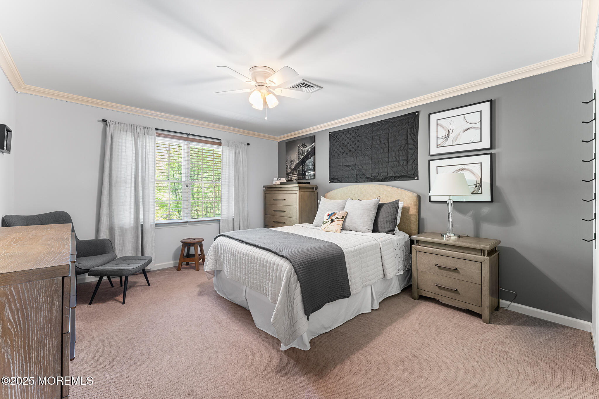 109 Merrick Road Farmingdale, NJ 07727 - Photo 35 of 62 a spacious bedroom with a bed and a chandelier